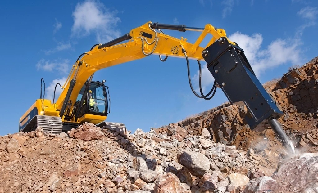 Excavator with hoses
